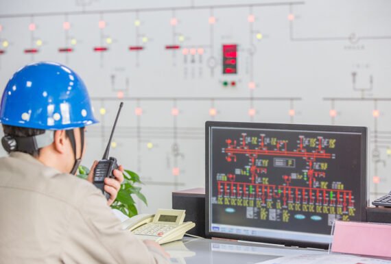 workers in control room of a factory.